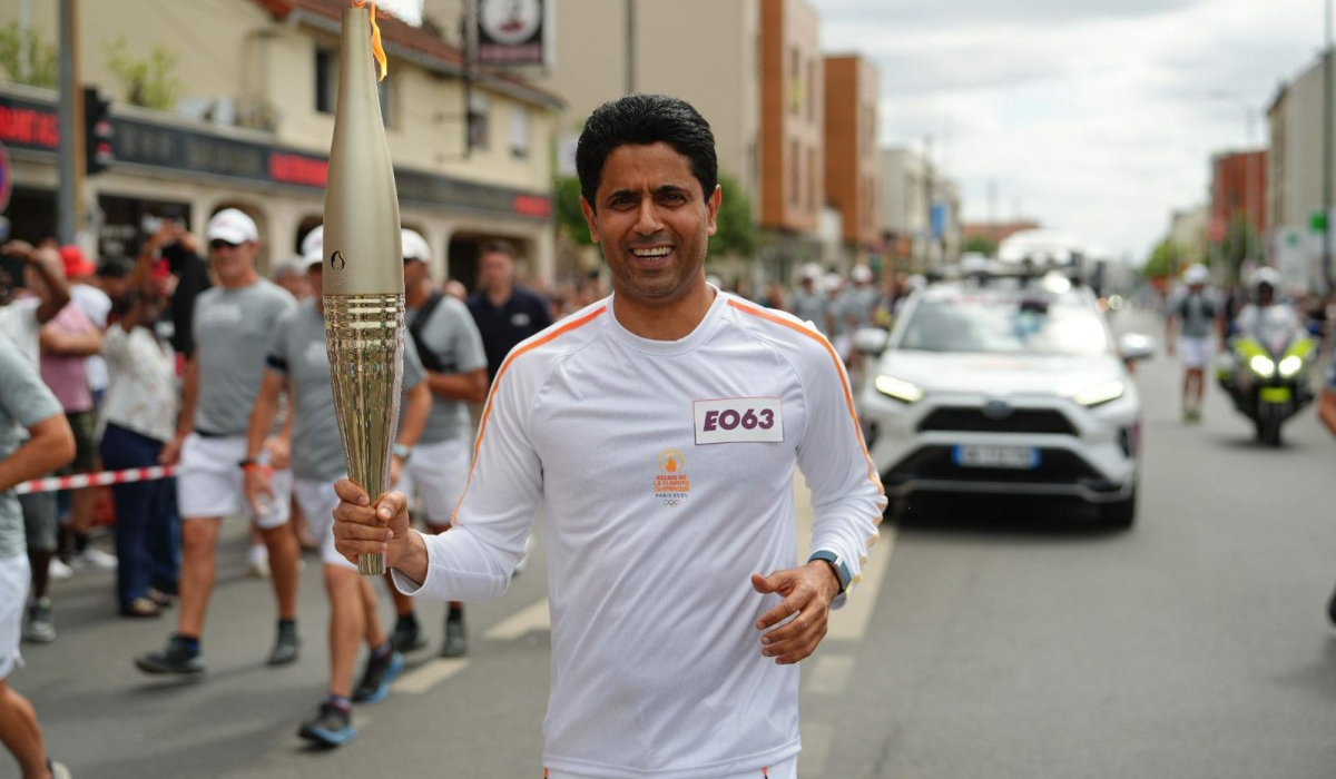 PSG's Al-Khelaifi Runs With the Olympic Flame Through the Streets of Vigneux